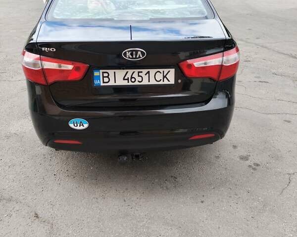 Чорний Кіа Ріо, об'ємом двигуна 1.4 л та пробігом 123 тис. км за 7600 $, фото 1 на Automoto.ua