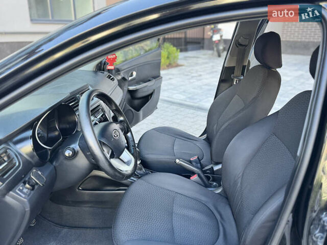 Чорний Кіа Ріо, об'ємом двигуна 1.4 л та пробігом 199 тис. км за 5950 $, фото 10 на Automoto.ua