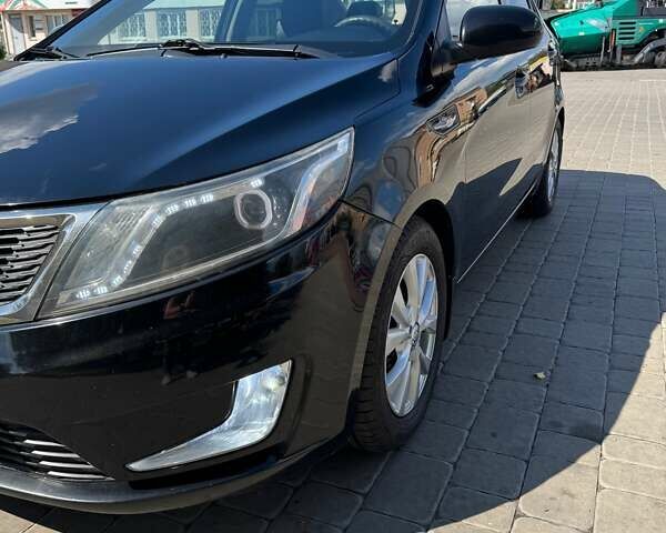 Чорний Кіа Ріо, об'ємом двигуна 1.4 л та пробігом 158 тис. км за 8300 $, фото 9 на Automoto.ua