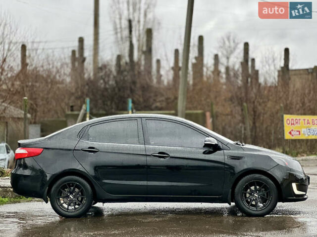 Черный Киа Рио, объемом двигателя 1.6 л и пробегом 231 тыс. км за 7999 $, фото 3 на Automoto.ua