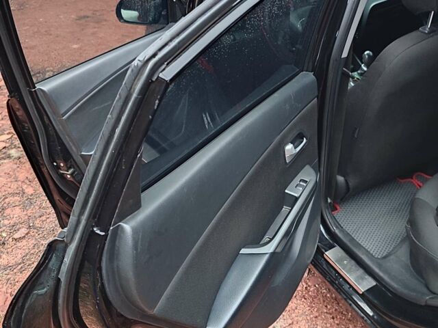 Чорний Кіа Ріо, об'ємом двигуна 1.4 л та пробігом 170 тис. км за 8500 $, фото 9 на Automoto.ua