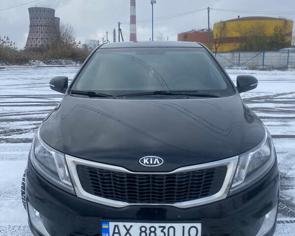 Черный Киа Рио, объемом двигателя 1.59 л и пробегом 249 тыс. км за 6900 $, фото 1 на Automoto.ua