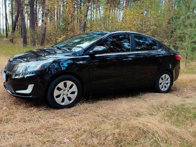 Чорний Кіа Ріо, об'ємом двигуна 0 л та пробігом 125 тис. км за 7099 $, фото 2 на Automoto.ua