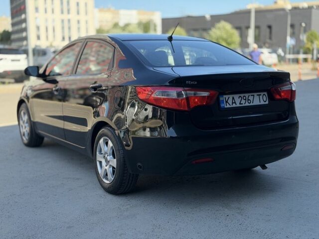 Чорний Кіа Ріо, об'ємом двигуна 1.4 л та пробігом 201 тис. км за 6948 $, фото 2 на Automoto.ua