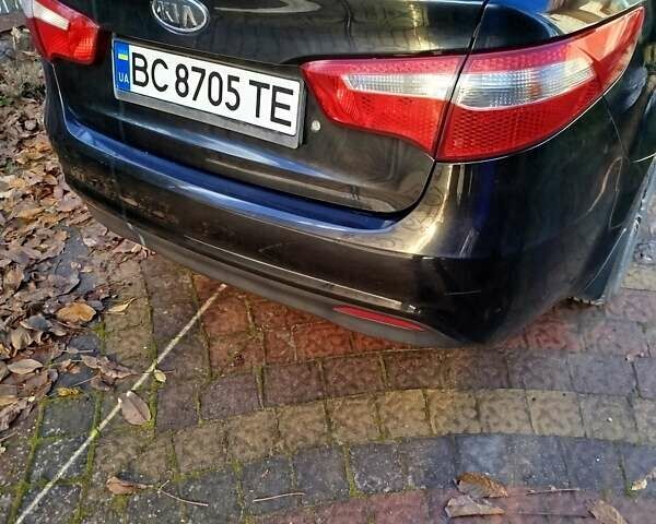 Чорний Кіа Ріо, об'ємом двигуна 1.4 л та пробігом 95 тис. км за 7000 $, фото 4 на Automoto.ua