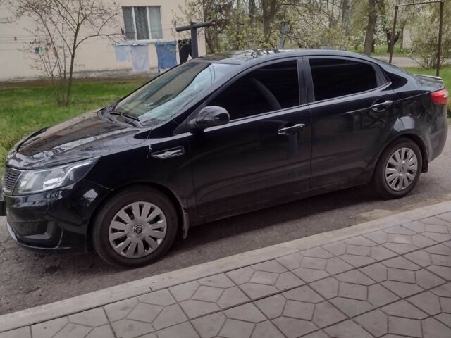 Черный Киа Рио, объемом двигателя 1.4 л и пробегом 140 тыс. км за 6800 $, фото 1 на Automoto.ua