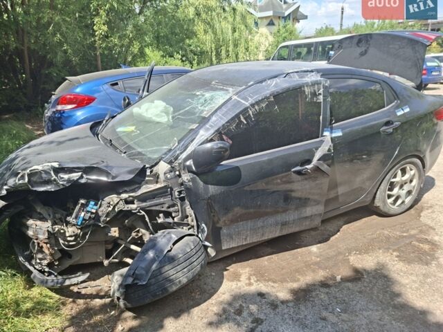 Чорний Кіа Ріо, об'ємом двигуна 1.4 л та пробігом 255 тис. км за 2701 $, фото 11 на Automoto.ua