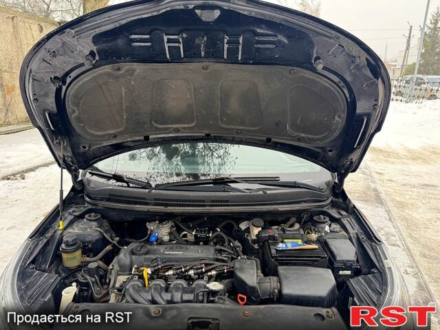 Черный Киа Рио, объемом двигателя 1.4 л и пробегом 155 тыс. км за 7500 $, фото 13 на Automoto.ua