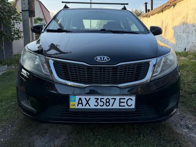 Чорний Кіа Ріо, об'ємом двигуна 1.4 л та пробігом 73 тис. км за 8900 $, фото 2 на Automoto.ua