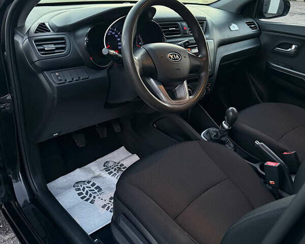 Чорний Кіа Ріо, об'ємом двигуна 1.4 л та пробігом 136 тис. км за 6900 $, фото 10 на Automoto.ua