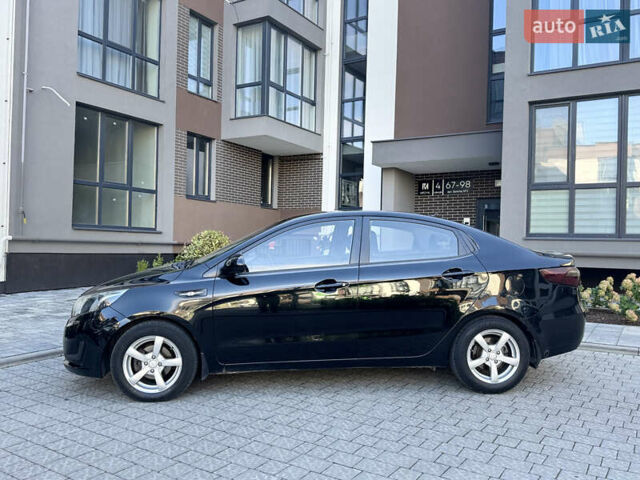 Чорний Кіа Ріо, об'ємом двигуна 1.4 л та пробігом 199 тис. км за 6300 $, фото 3 на Automoto.ua
