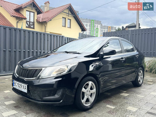 Чорний Кіа Ріо, об'ємом двигуна 1.4 л та пробігом 199 тис. км за 5999 $, фото 2 на Automoto.ua