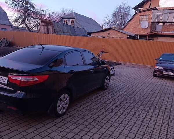 Чорний Кіа Ріо, об'ємом двигуна 1.4 л та пробігом 162 тис. км за 7500 $, фото 6 на Automoto.ua