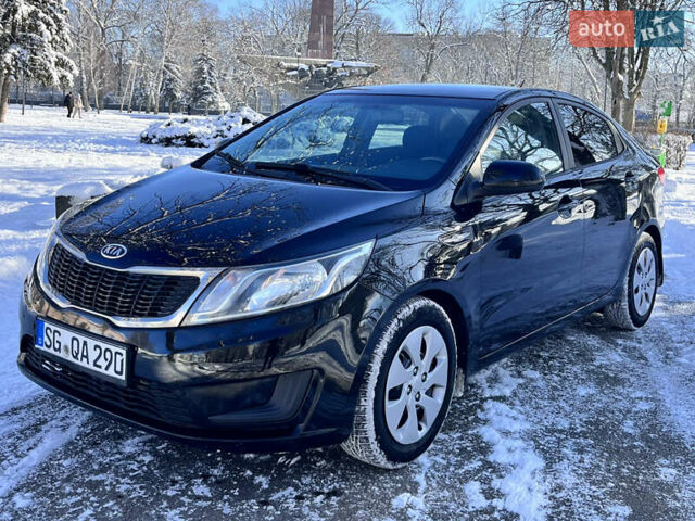 Чорний Кіа Ріо, об'ємом двигуна 1.4 л та пробігом 245 тис. км за 7600 $, фото 5 на Automoto.ua