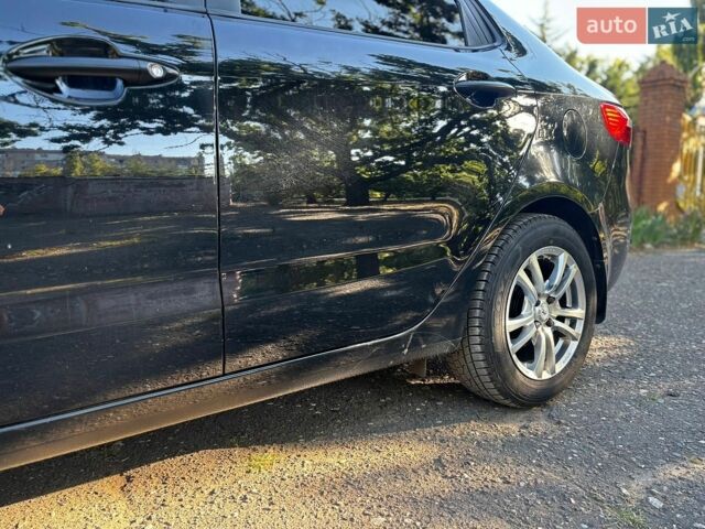 Чорний Кіа Ріо, об'ємом двигуна 1.4 л та пробігом 165 тис. км за 7900 $, фото 10 на Automoto.ua