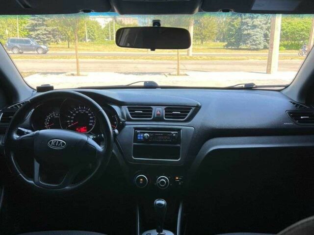 Чорний Кіа Ріо, об'ємом двигуна 1.4 л та пробігом 102 тис. км за 7394 $, фото 1 на Automoto.ua