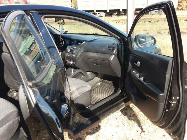 Чорний Кіа Ріо, об'ємом двигуна 1.4 л та пробігом 77 тис. км за 8500 $, фото 5 на Automoto.ua