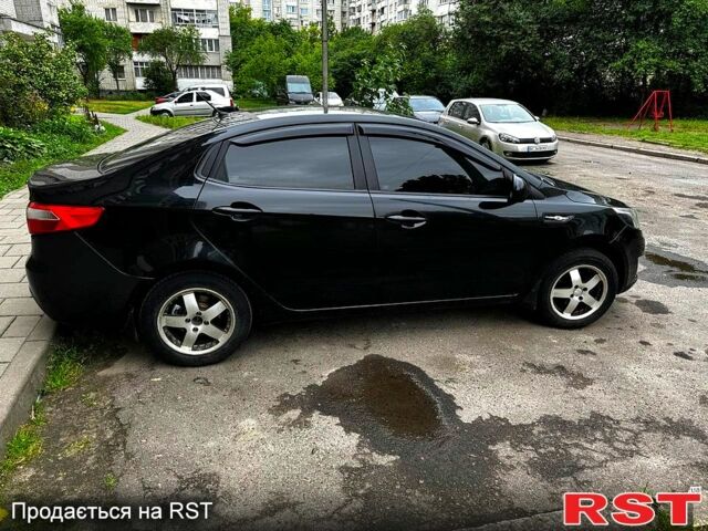 Черный Киа Рио, объемом двигателя 1.6 л и пробегом 330 тыс. км за 5700 $, фото 2 на Automoto.ua