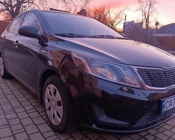 Чорний Кіа Ріо, об'ємом двигуна 1.4 л та пробігом 162 тис. км за 7500 $, фото 5 на Automoto.ua