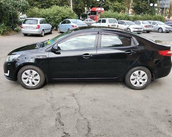 Чорний Кіа Ріо, об'ємом двигуна 1.4 л та пробігом 123 тис. км за 7600 $, фото 2 на Automoto.ua