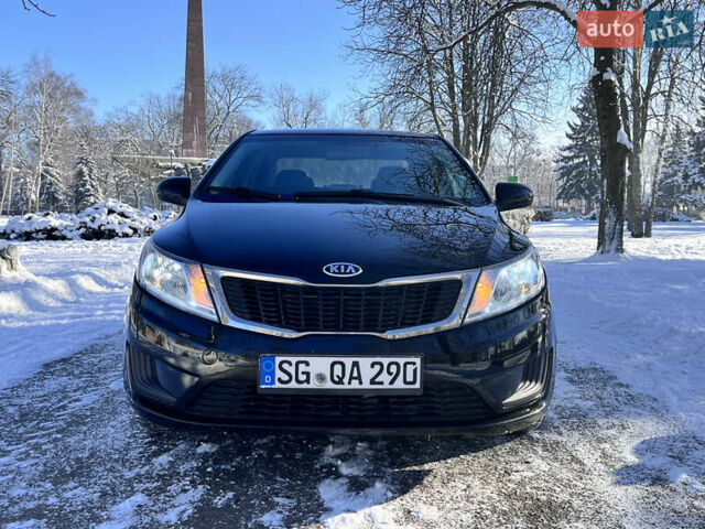 Чорний Кіа Ріо, об'ємом двигуна 1.4 л та пробігом 245 тис. км за 7600 $, фото 19 на Automoto.ua