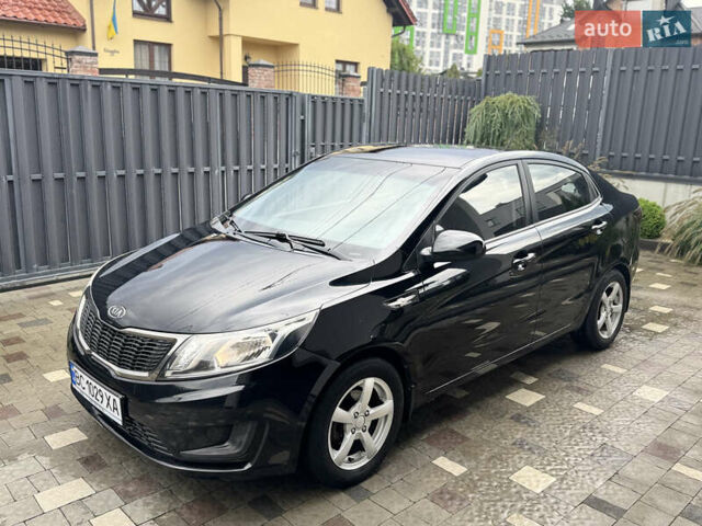 Чорний Кіа Ріо, об'ємом двигуна 1.4 л та пробігом 199 тис. км за 5999 $, фото 1 на Automoto.ua
