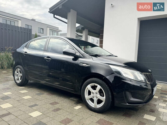 Чорний Кіа Ріо, об'ємом двигуна 1.4 л та пробігом 199 тис. км за 5999 $, фото 8 на Automoto.ua