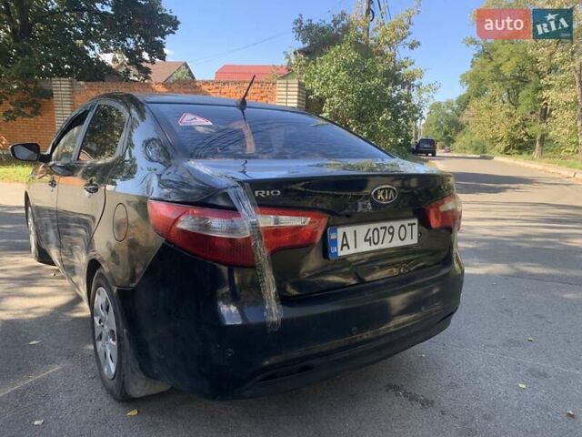 Чорний Кіа Ріо, об'ємом двигуна 1.4 л та пробігом 146 тис. км за 5075 $, фото 3 на Automoto.ua