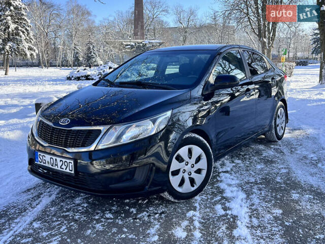 Чорний Кіа Ріо, об'ємом двигуна 1.4 л та пробігом 245 тис. км за 7600 $, фото 2 на Automoto.ua