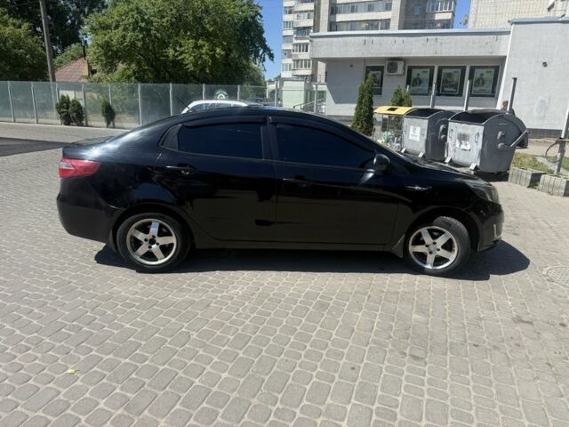 Черный Киа Рио, объемом двигателя 1.6 л и пробегом 330 тыс. км за 5500 $, фото 1 на Automoto.ua