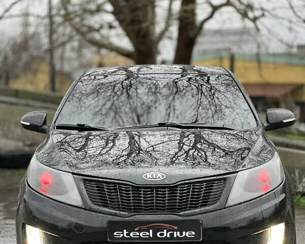 Черный Киа Рио, объемом двигателя 1.6 л и пробегом 231 тыс. км за 7999 $, фото 1 на Automoto.ua