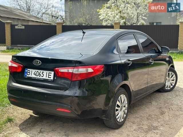 Черный Киа Рио, объемом двигателя 1.4 л и пробегом 108 тыс. км за 7950 $, фото 3 на Automoto.ua