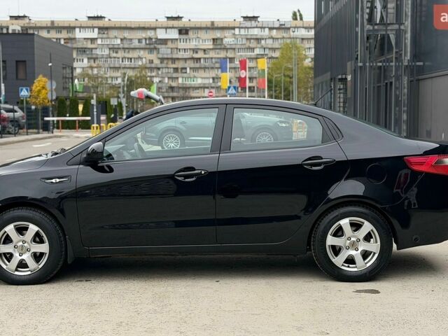Чорний Кіа Ріо, об'ємом двигуна 1.4 л та пробігом 202 тис. км за 6900 $, фото 1 на Automoto.ua