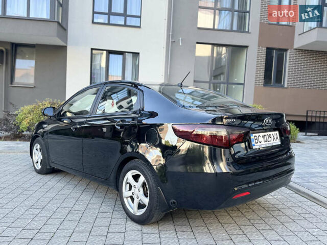 Чорний Кіа Ріо, об'ємом двигуна 1.4 л та пробігом 199 тис. км за 5950 $, фото 4 на Automoto.ua