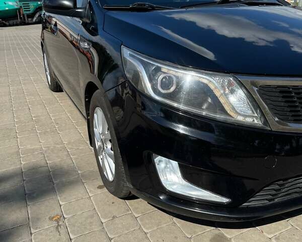 Чорний Кіа Ріо, об'ємом двигуна 1.4 л та пробігом 158 тис. км за 8300 $, фото 8 на Automoto.ua