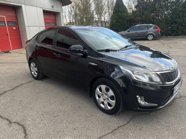 Чорний Кіа Ріо, об'ємом двигуна 1.6 л та пробігом 273 тис. км за 6200 $, фото 2 на Automoto.ua