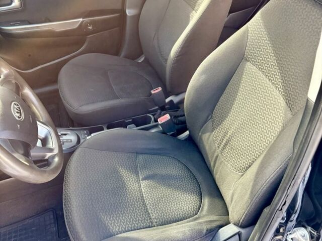 Чорний Кіа Ріо, об'ємом двигуна 1.6 л та пробігом 270 тис. км за 6499 $, фото 9 на Automoto.ua