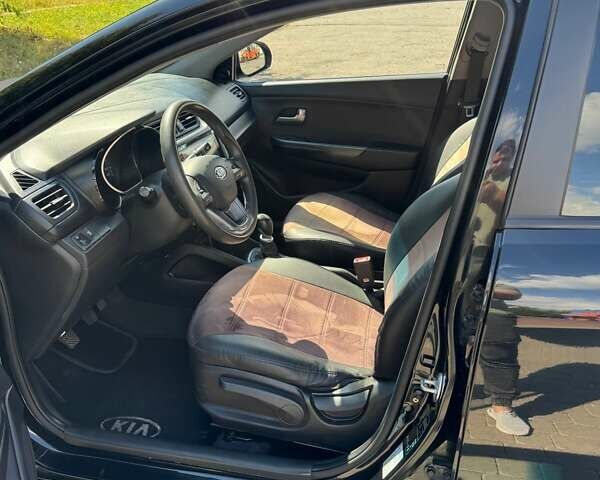 Чорний Кіа Ріо, об'ємом двигуна 1.4 л та пробігом 158 тис. км за 8300 $, фото 11 на Automoto.ua
