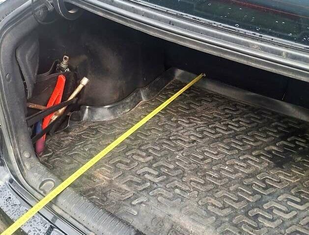 Черный Киа Рио, объемом двигателя 1.4 л и пробегом 197 тыс. км за 7000 $, фото 1 на Automoto.ua