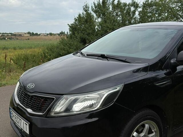 Чорний Кіа Ріо, об'ємом двигуна 1.6 л та пробігом 104 тис. км за 8500 $, фото 16 на Automoto.ua