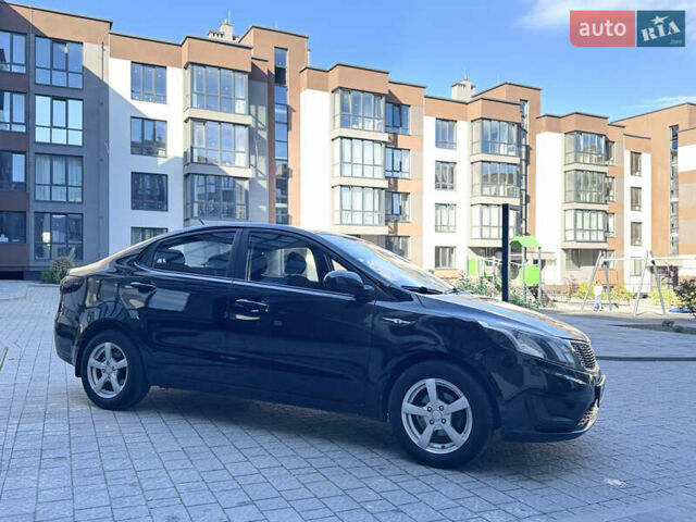 Чорний Кіа Ріо, об'ємом двигуна 1.4 л та пробігом 199 тис. км за 5950 $, фото 7 на Automoto.ua