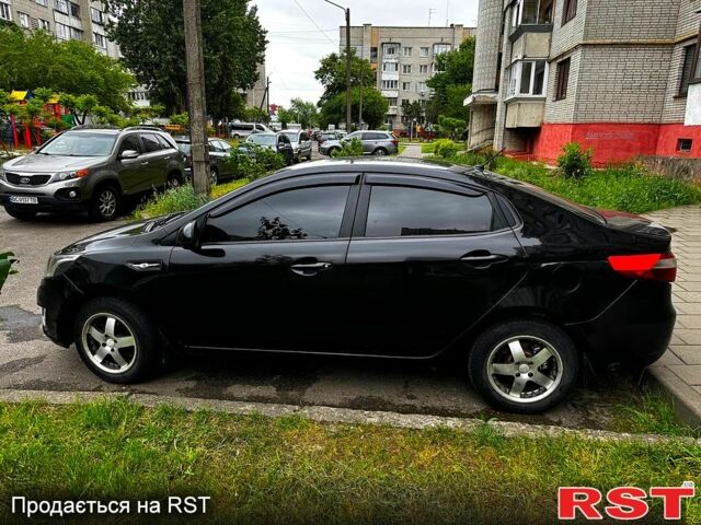 Черный Киа Рио, объемом двигателя 1.6 л и пробегом 330 тыс. км за 5700 $, фото 3 на Automoto.ua