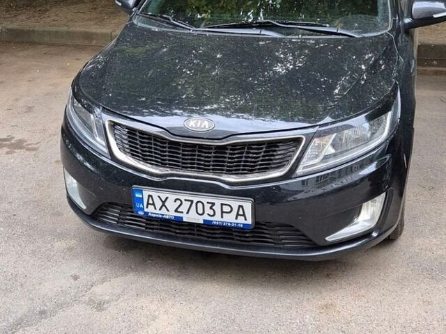 Черный Киа Рио, объемом двигателя 1.59 л и пробегом 127 тыс. км за 8800 $, фото 1 на Automoto.ua