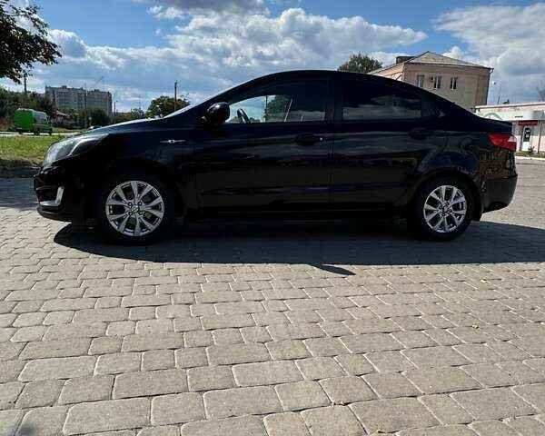 Чорний Кіа Ріо, об'ємом двигуна 1.4 л та пробігом 158 тис. км за 8300 $, фото 2 на Automoto.ua