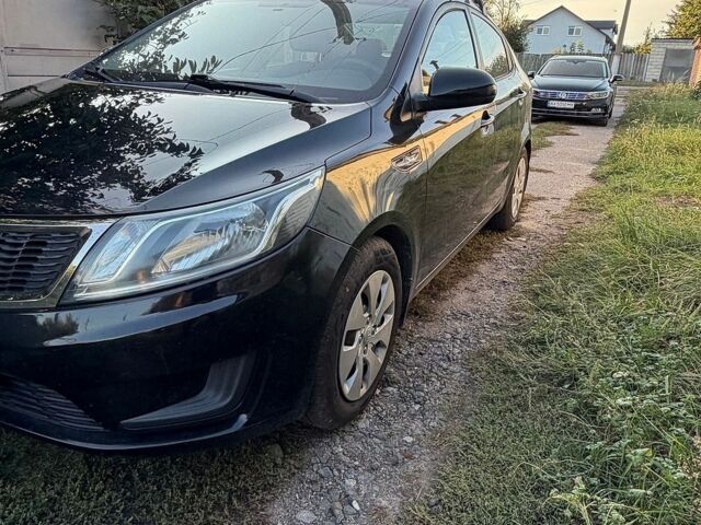 Чорний Кіа Ріо, об'ємом двигуна 1.4 л та пробігом 73 тис. км за 8900 $, фото 4 на Automoto.ua
