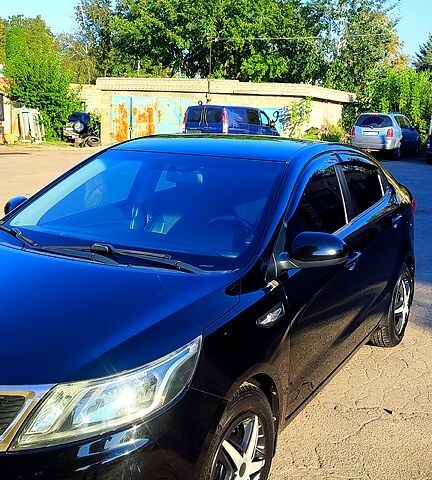 Черный Киа Рио, объемом двигателя 1.4 л и пробегом 120 тыс. км за 7700 $, фото 4 на Automoto.ua