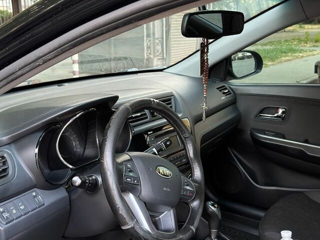 Чорний Кіа Ріо, об'ємом двигуна 1.6 л та пробігом 104 тис. км за 8500 $, фото 8 на Automoto.ua
