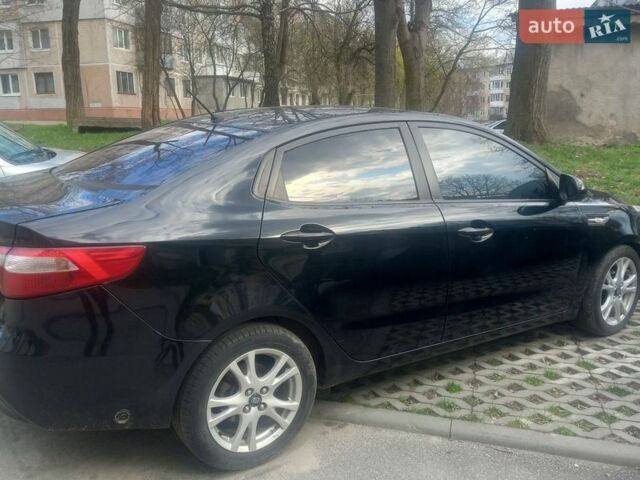 Черный Киа Рио, объемом двигателя 1.4 л и пробегом 213 тыс. км за 8700 $, фото 2 на Automoto.ua