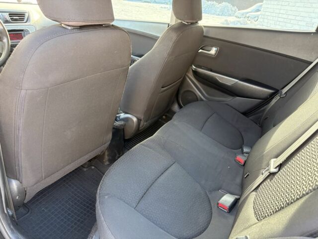 Чорний Кіа Ріо, об'ємом двигуна 1.6 л та пробігом 270 тис. км за 6499 $, фото 12 на Automoto.ua