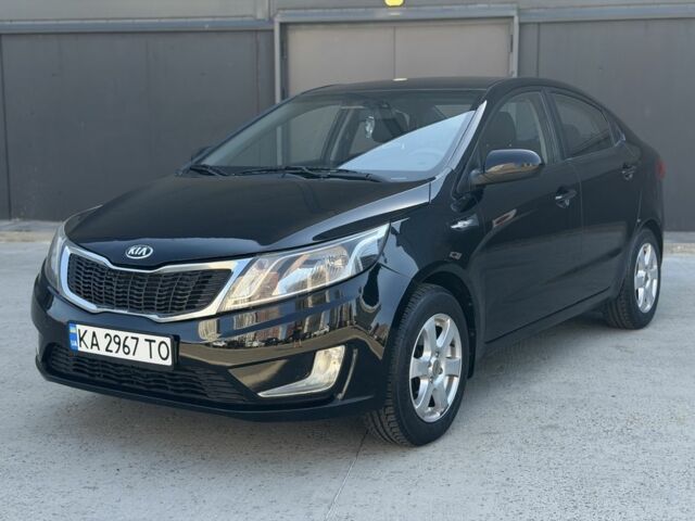 Чорний Кіа Ріо, об'ємом двигуна 1.4 л та пробігом 201 тис. км за 6948 $, фото 8 на Automoto.ua